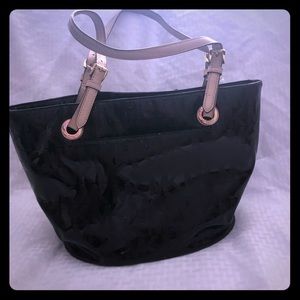 Michael Kors black patent leather purse.